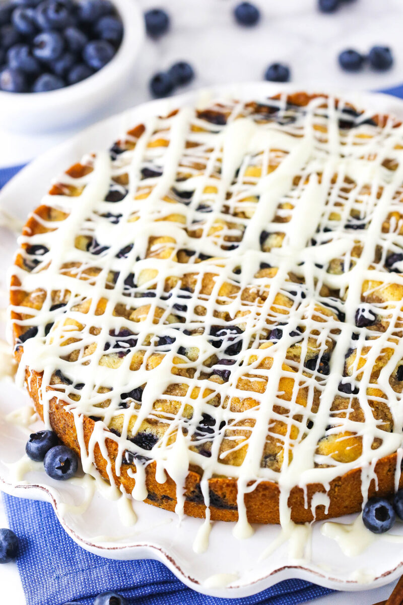 image of full blueberry streusel coffee cake on white platter