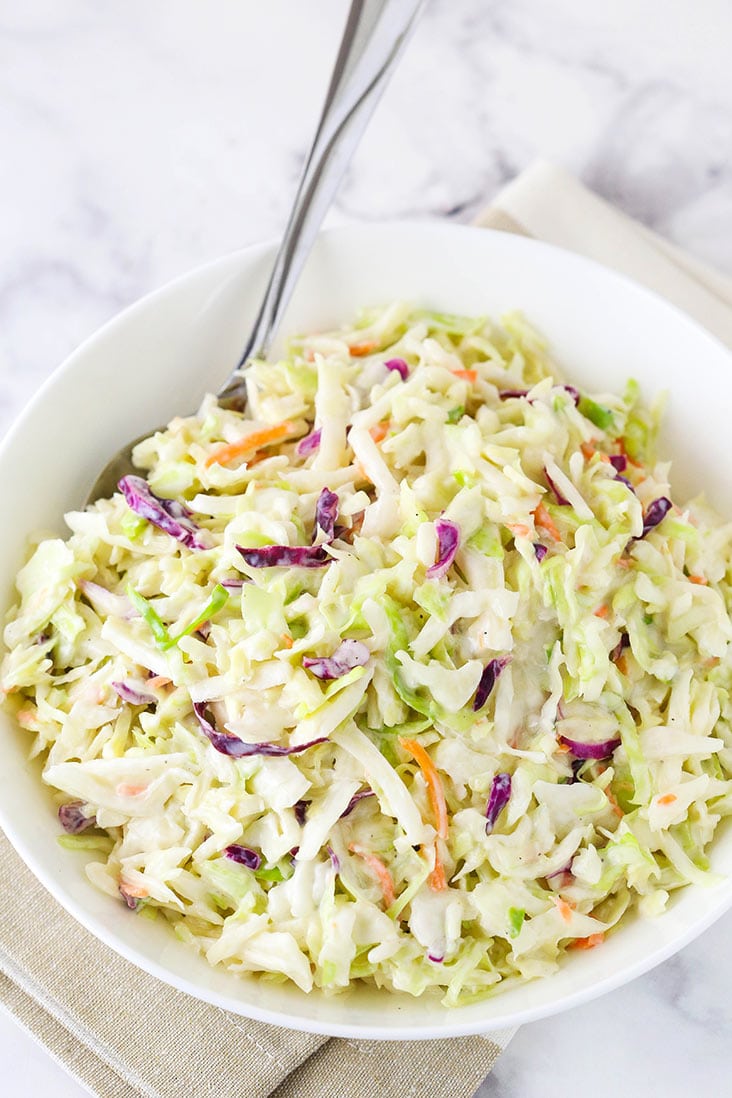 A bowl of classic easy coleslaw with a spoon