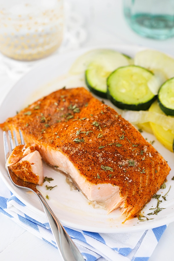 image of Easy Creole Salmon on white plate with bite removed