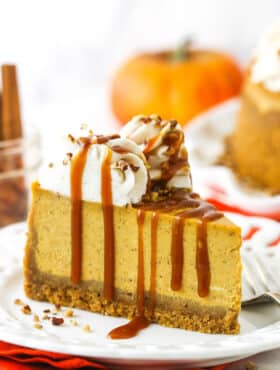 A slice of pumpkin cheesecake topped with a drizzle of homemade caramel sauce