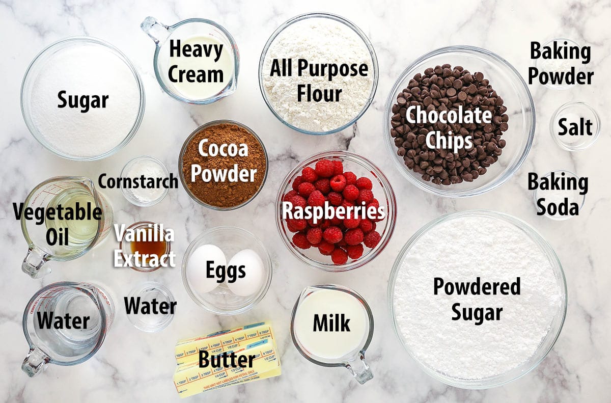 Ingredients for chocolate raspberry cake separated into bowls.