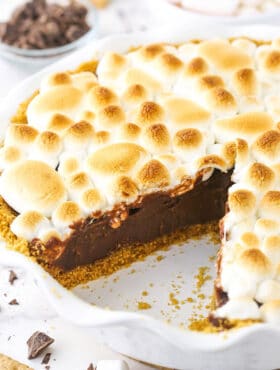 Smore's chocolate pie with a slice taken out so you can see the inside of the pie.